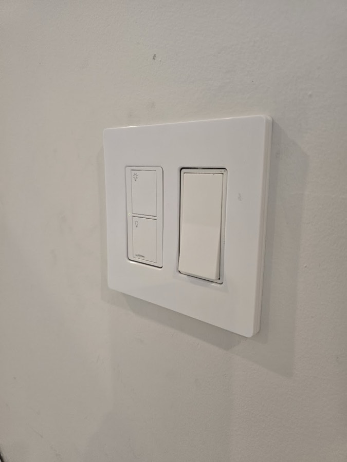 Newly installed switch plate on a finished wall